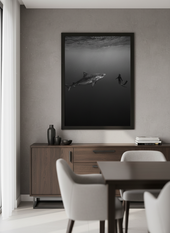 Wall art styled above a dining table in a contemporary home