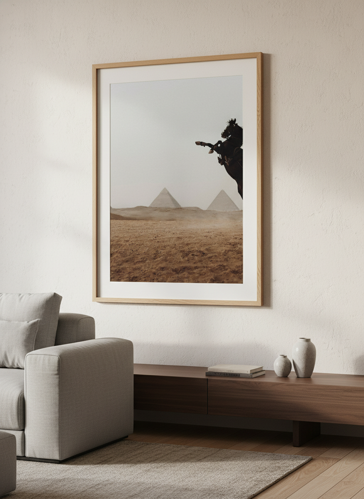 Modern wall art styled above a sofa in a neutral living room