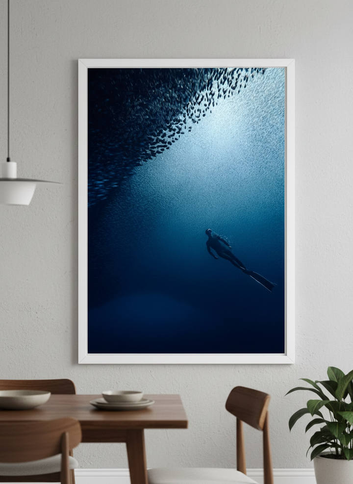 Wall art styled above a dining table in a contemporary home