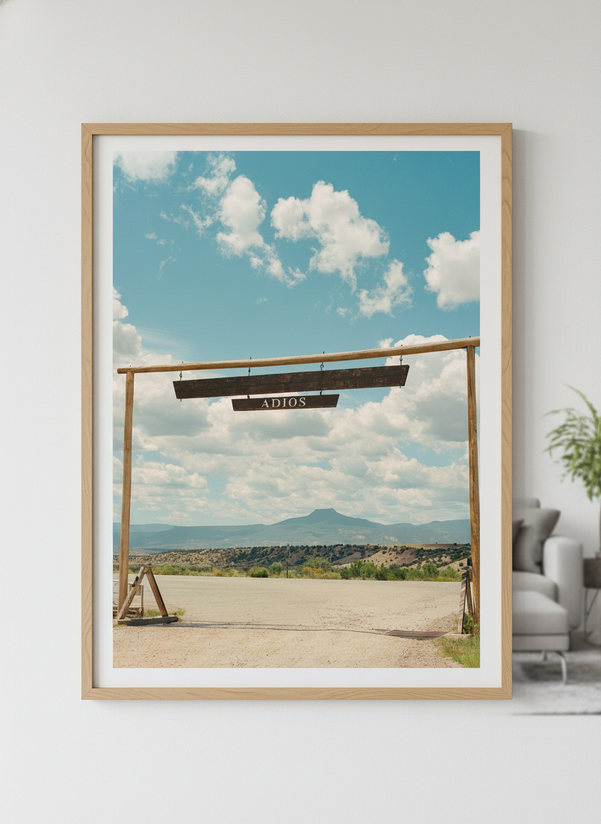 Modern wall art styled above a sofa in a neutral living room