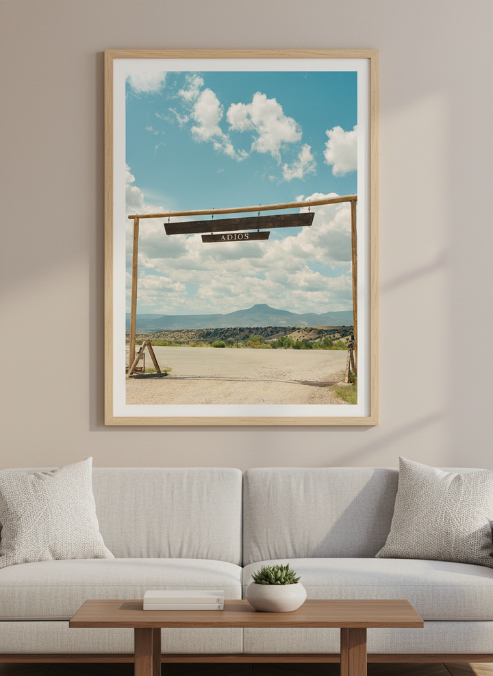 Modern wall art styled above a sofa in a neutral living room
