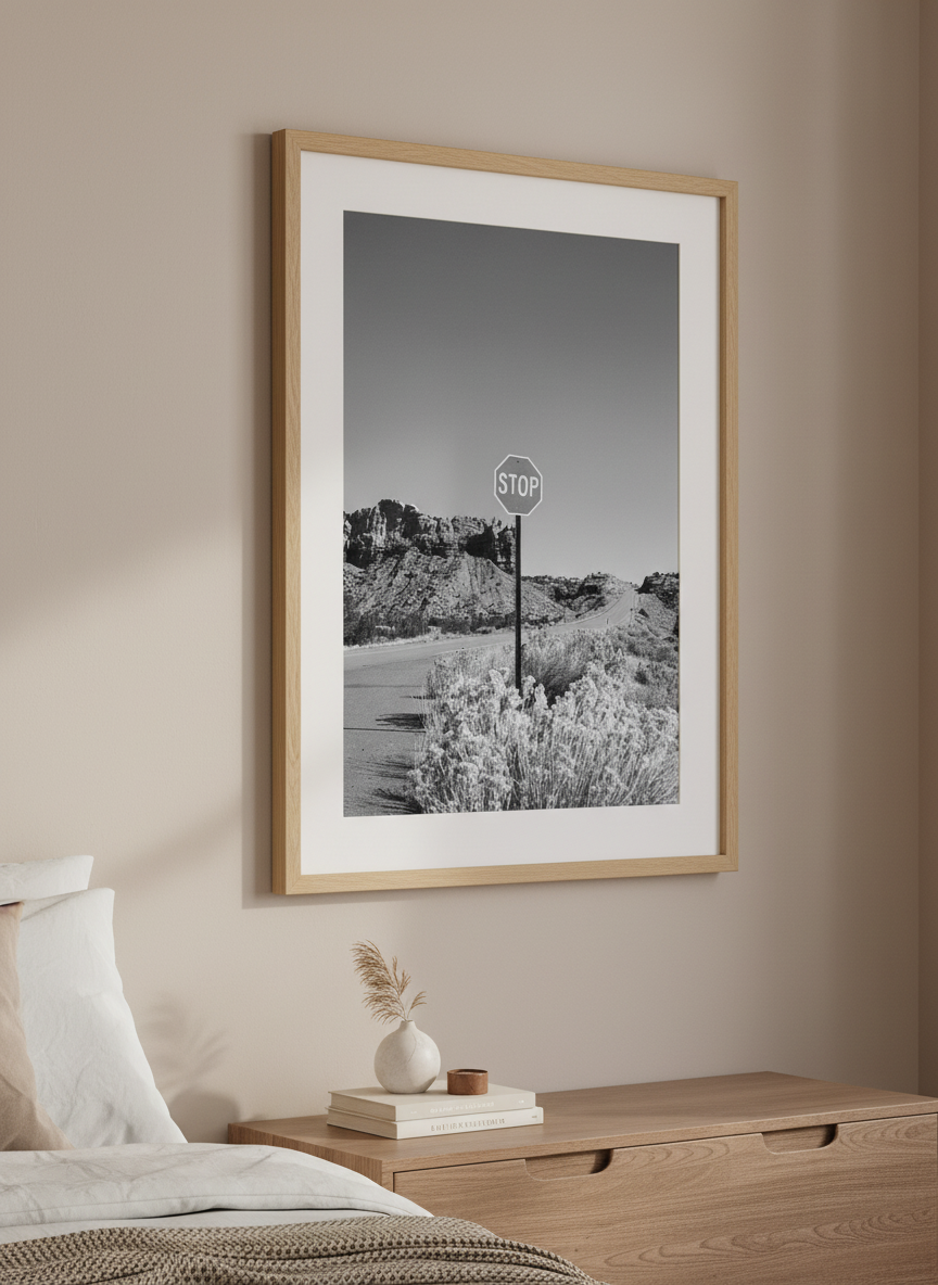 Minimalist artwork displayed in a calm, light-filled bedroom interior