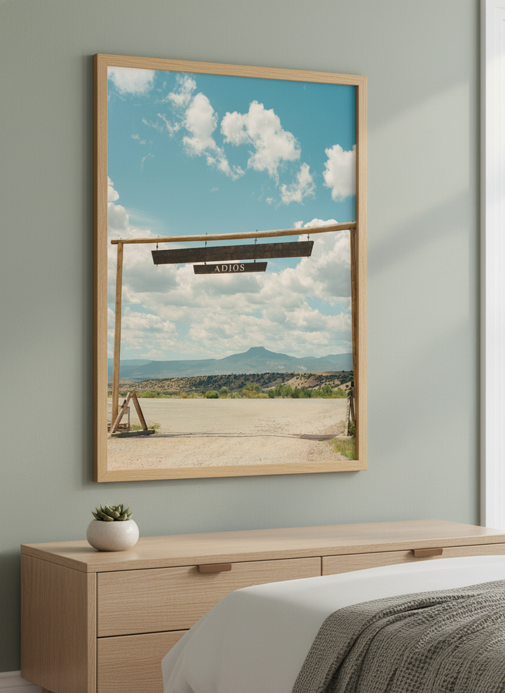 Minimalist artwork displayed in a calm, light-filled bedroom interior
