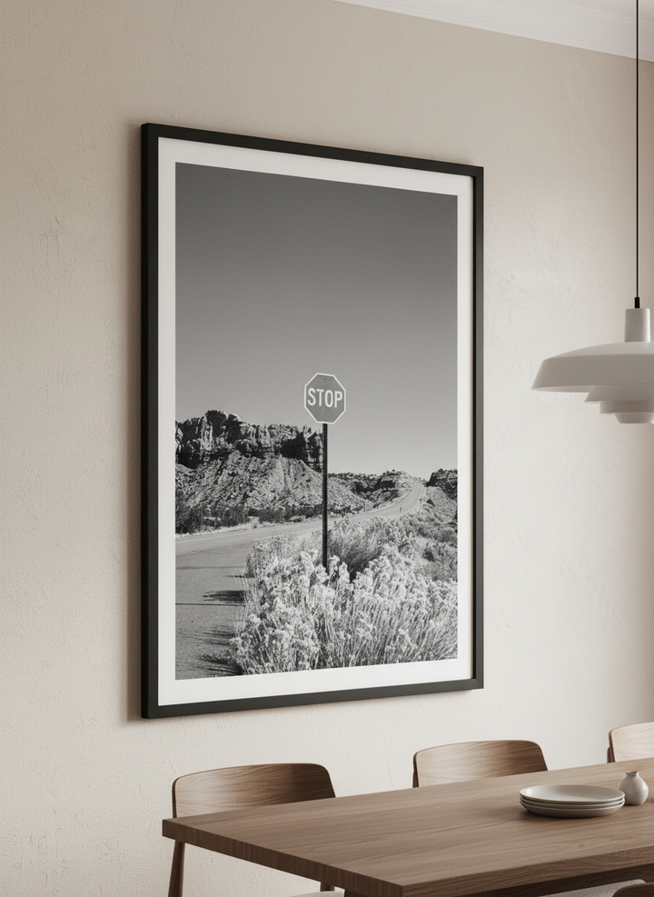 Wall art styled above a dining table in a contemporary home