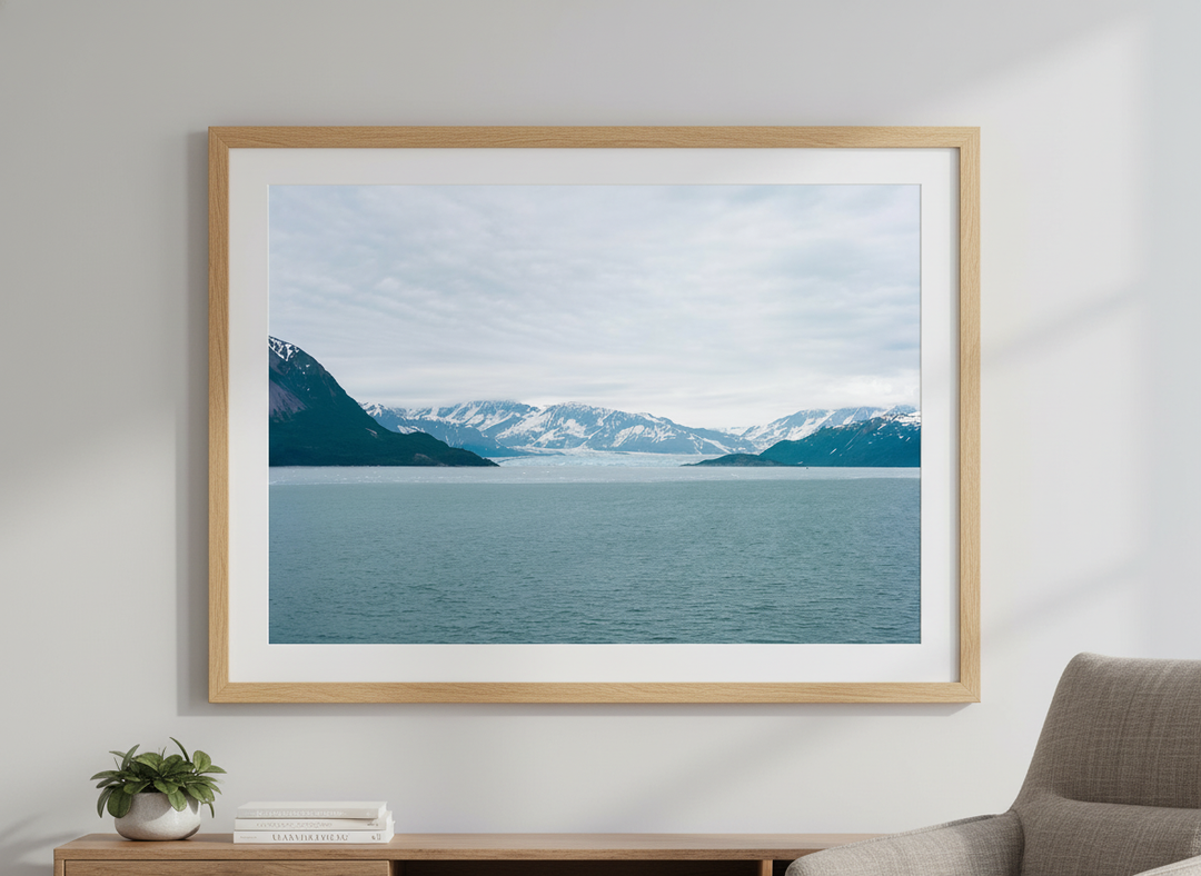 Modern wall art styled above a sofa in a neutral living room