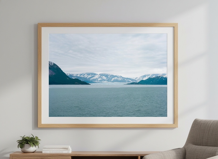 Modern wall art styled above a sofa in a neutral living room