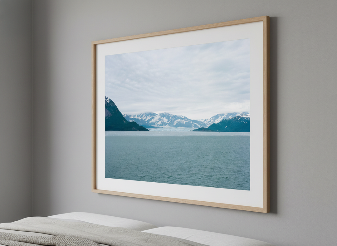 Minimalist artwork displayed in a calm, light-filled bedroom interior