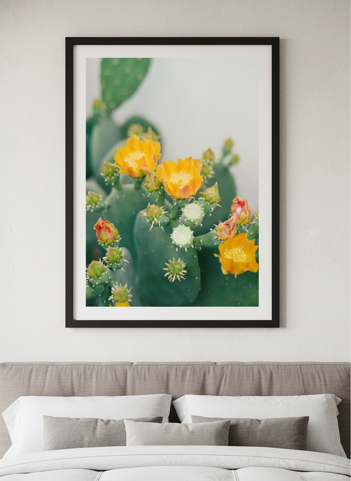 Minimalist artwork displayed in a calm, light-filled bedroom interior
