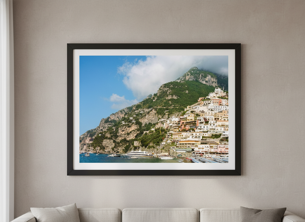 Modern wall art styled above a sofa in a neutral living room
