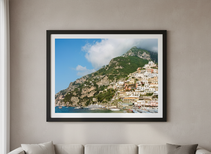 Modern wall art styled above a sofa in a neutral living room