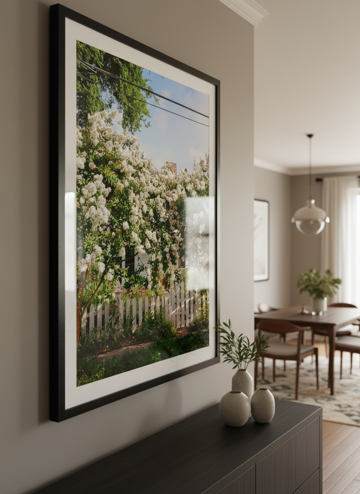 Wall art styled above a dining table in a contemporary home