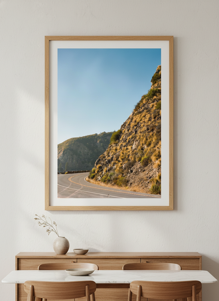 Wall art styled above a dining table in a contemporary home