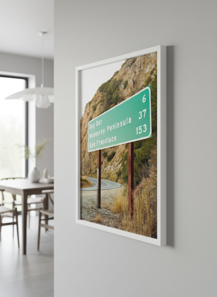 Wall art styled above a dining table in a contemporary home