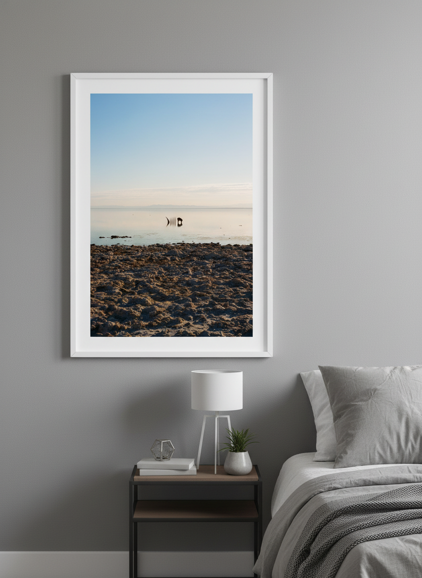 Minimalist artwork displayed in a calm, light-filled bedroom interior