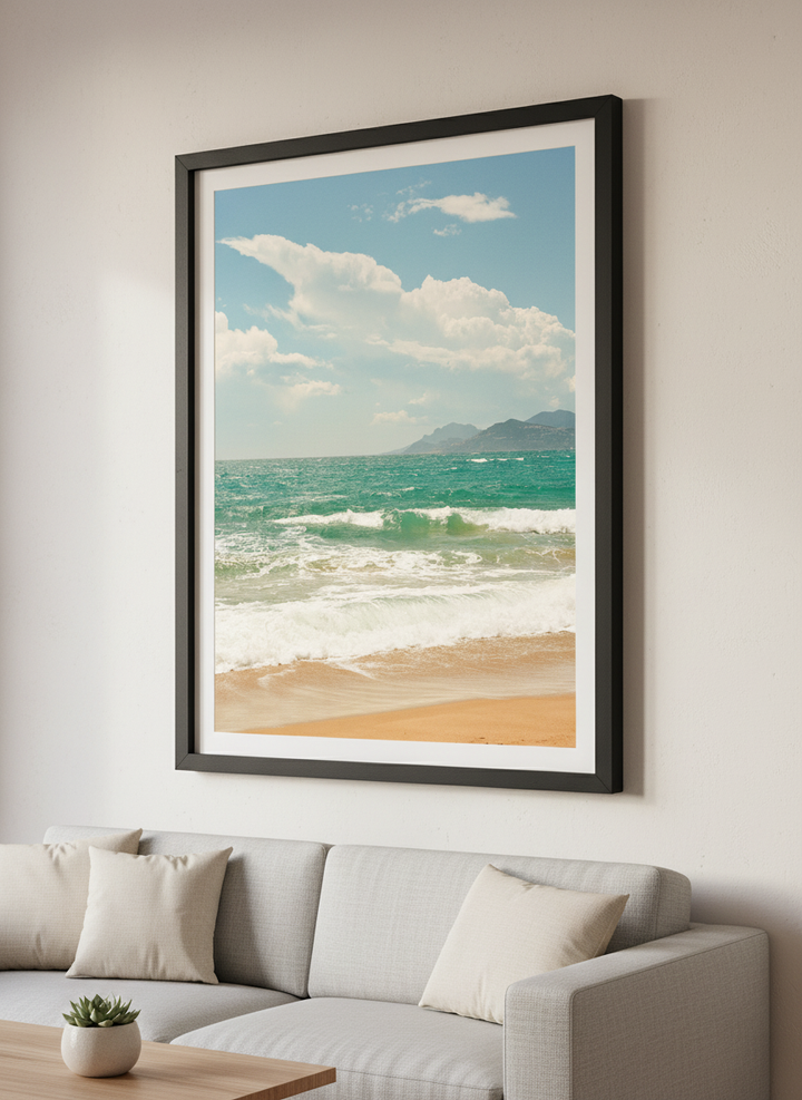 Modern wall art styled above a sofa in a neutral living room