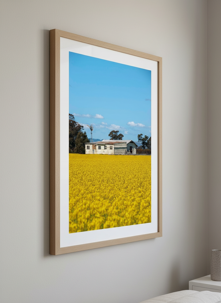Minimalist artwork displayed in a calm, light-filled bedroom interior