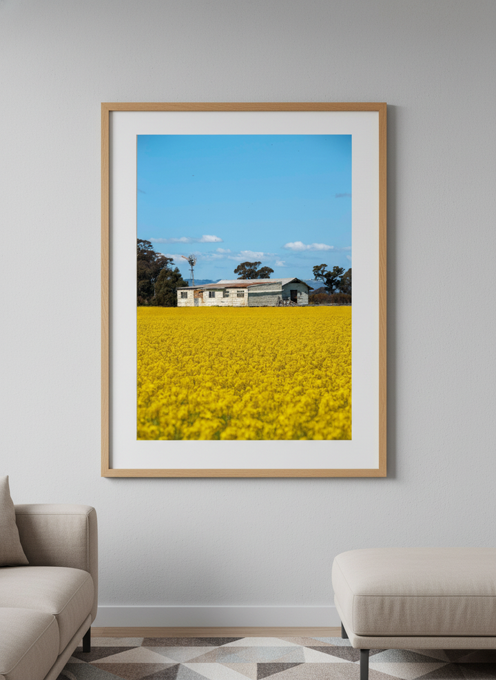 Modern wall art styled above a sofa in a neutral living room