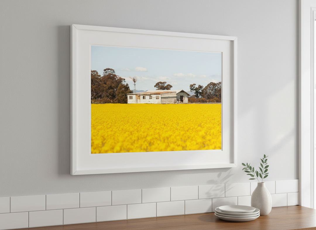 Artwork styled on the wall of a bright modern kitchen
