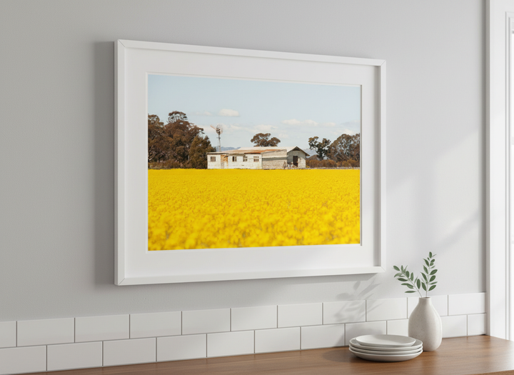 Artwork styled on the wall of a bright modern kitchen
