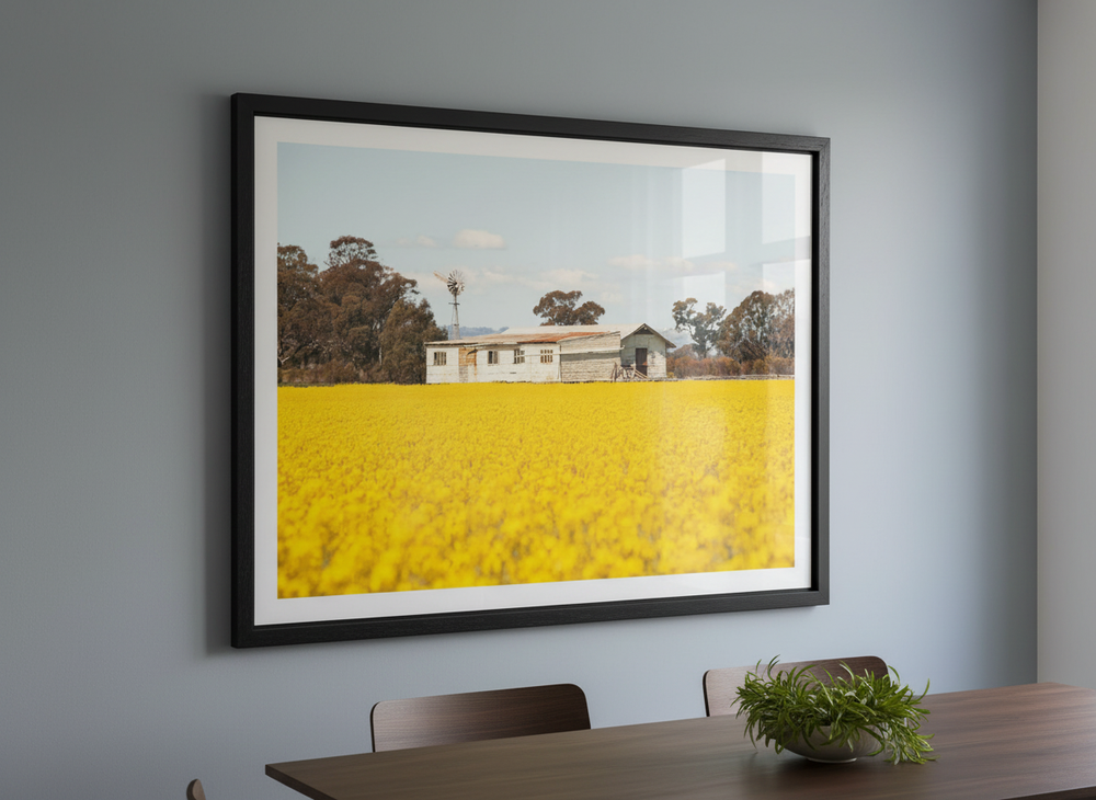 Wall art styled above a dining table in a contemporary home
