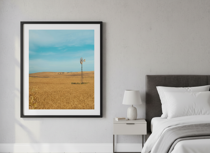 Minimalist artwork displayed in a calm, light-filled bedroom interior