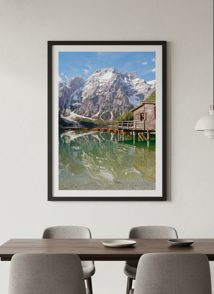 Wall art styled above a dining table in a contemporary home