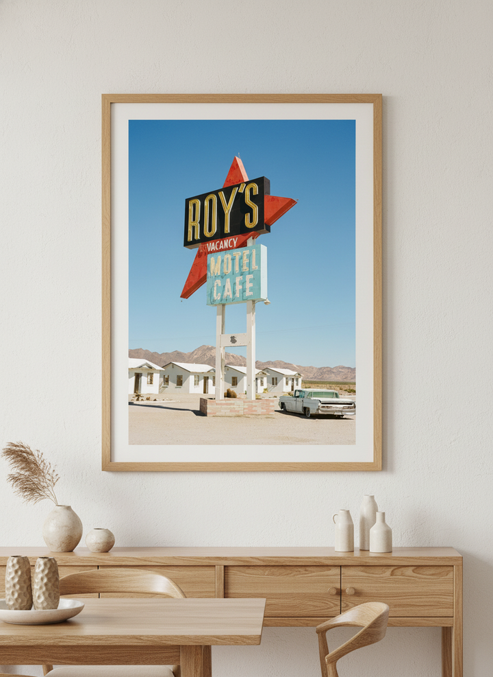 Wall art styled above a dining table in a contemporary home