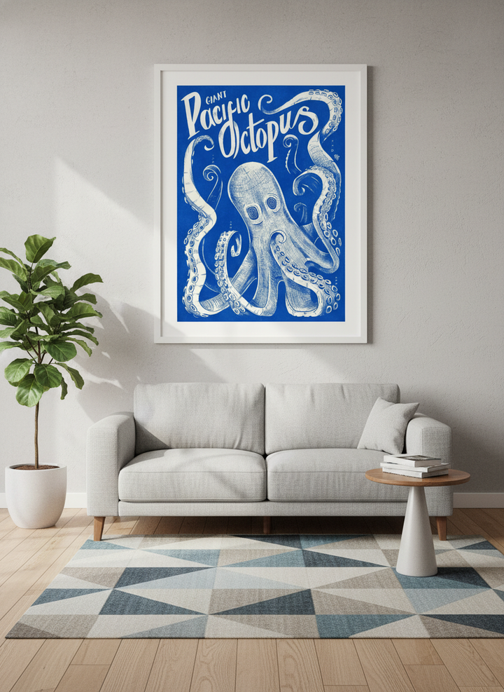Modern wall art styled above a sofa in a neutral living room