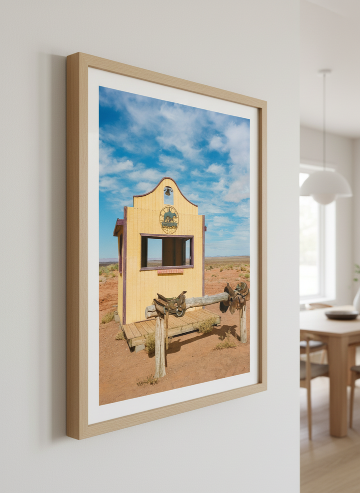 Wall art styled above a dining table in a contemporary home