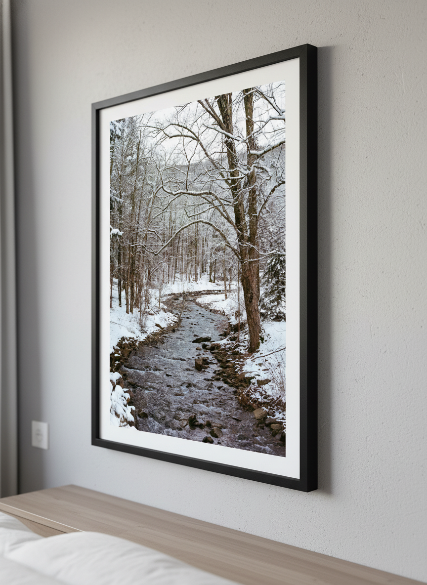 Minimalist artwork displayed in a calm, light-filled bedroom interior
