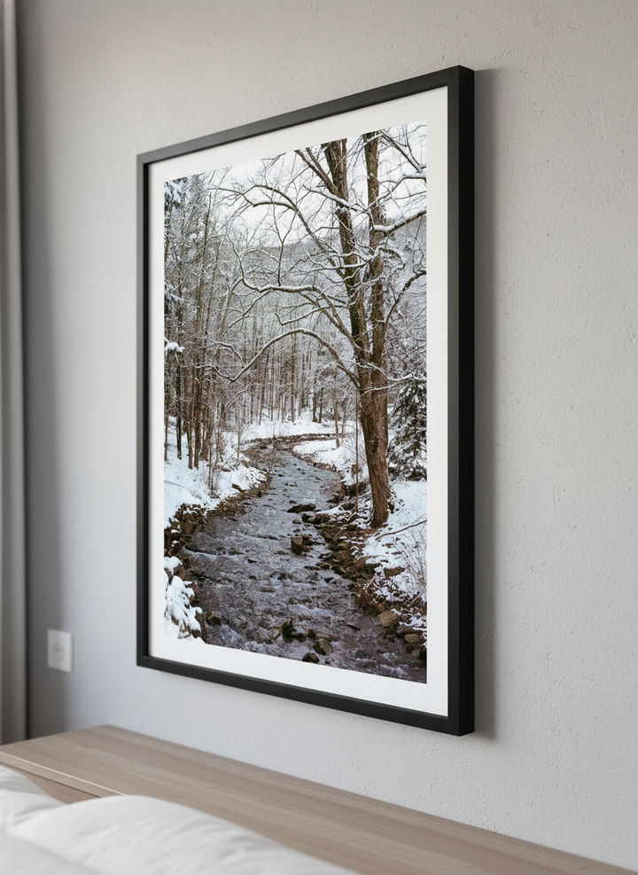 Minimalist artwork displayed in a calm, light-filled bedroom interior