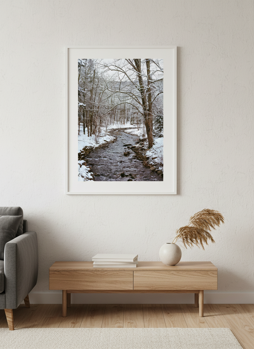 Modern wall art styled above a sofa in a neutral living room