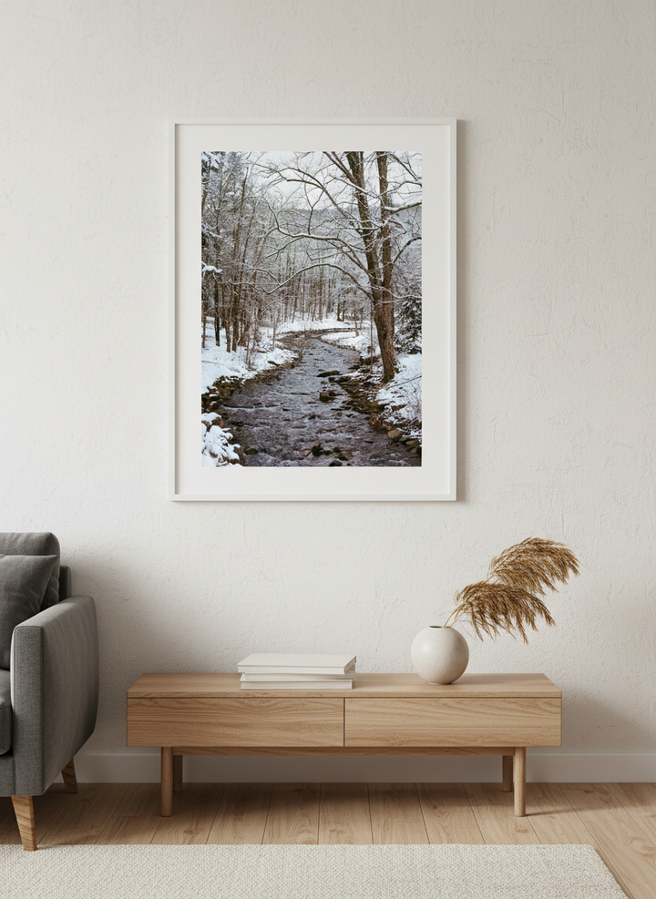 Modern wall art styled above a sofa in a neutral living room