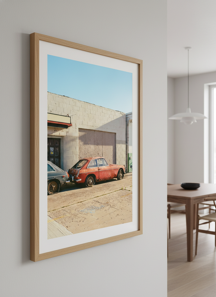 Wall art styled above a dining table in a contemporary home