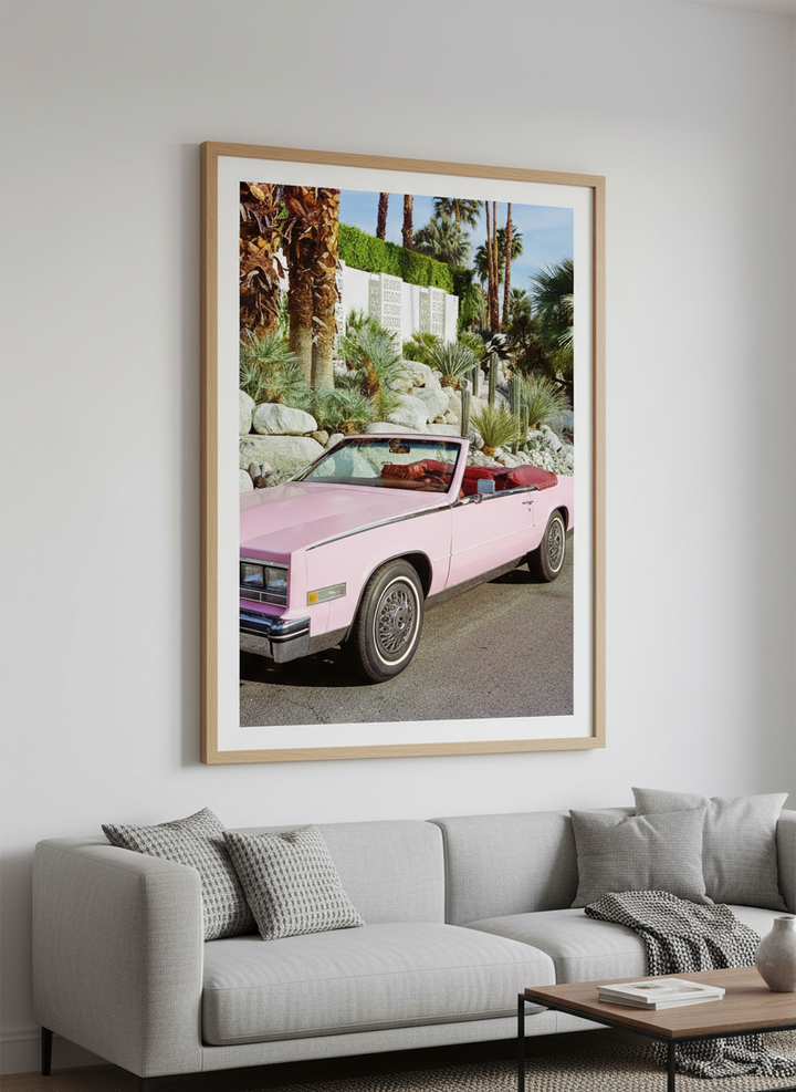 Modern wall art styled above a sofa in a neutral living room
