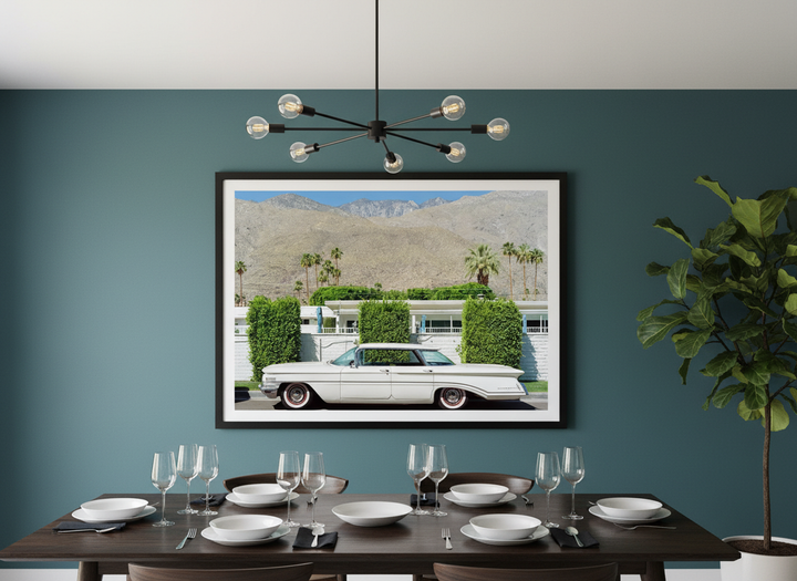 Wall art styled above a dining table in a contemporary home