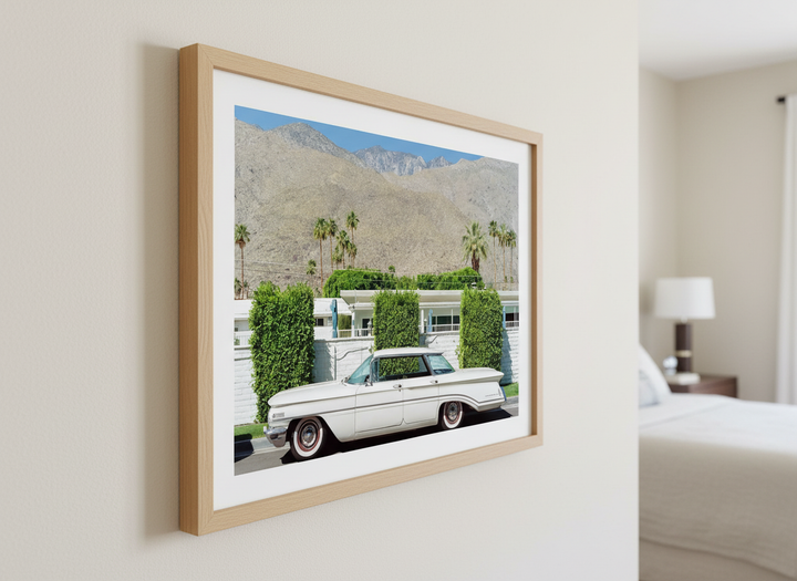 Minimalist artwork displayed in a calm, light-filled bedroom interior