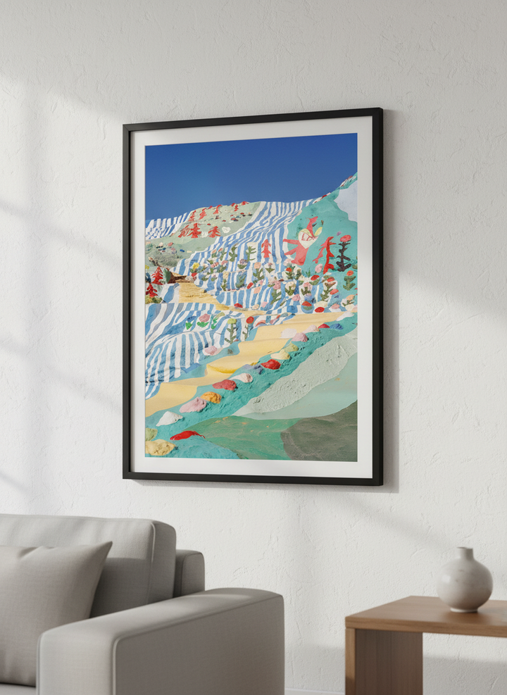 Modern wall art styled above a sofa in a neutral living room