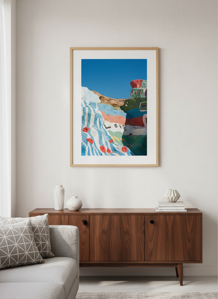 Modern wall art styled above a sofa in a neutral living room