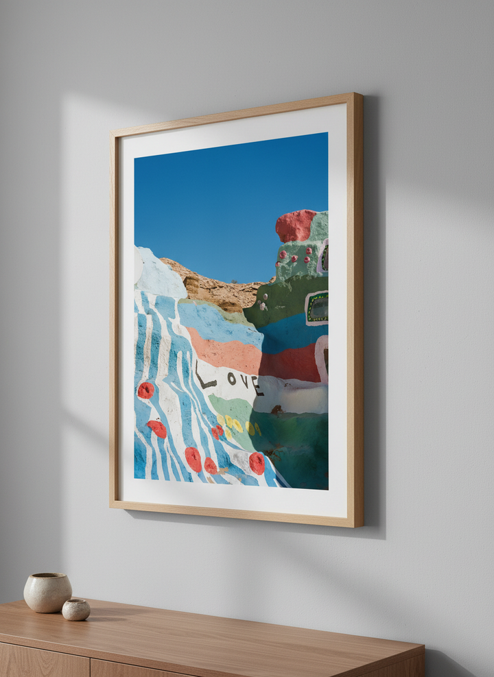 Minimalist artwork displayed in a calm, light-filled bedroom interior