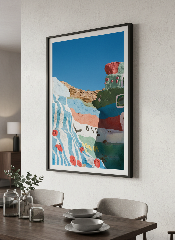 Wall art styled above a dining table in a contemporary home