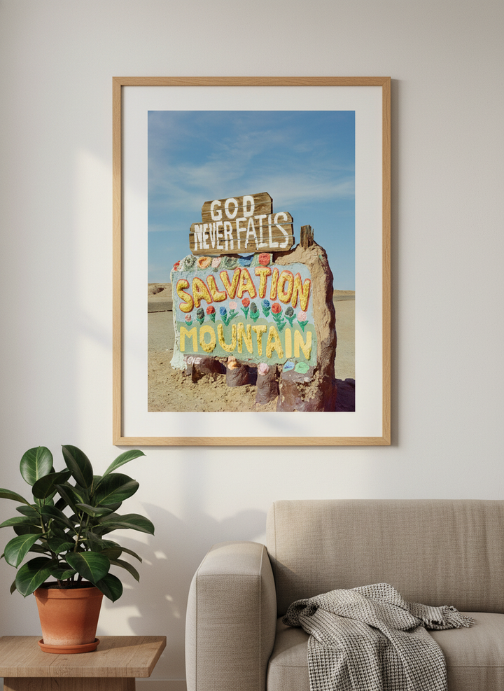 Modern wall art styled above a sofa in a neutral living room