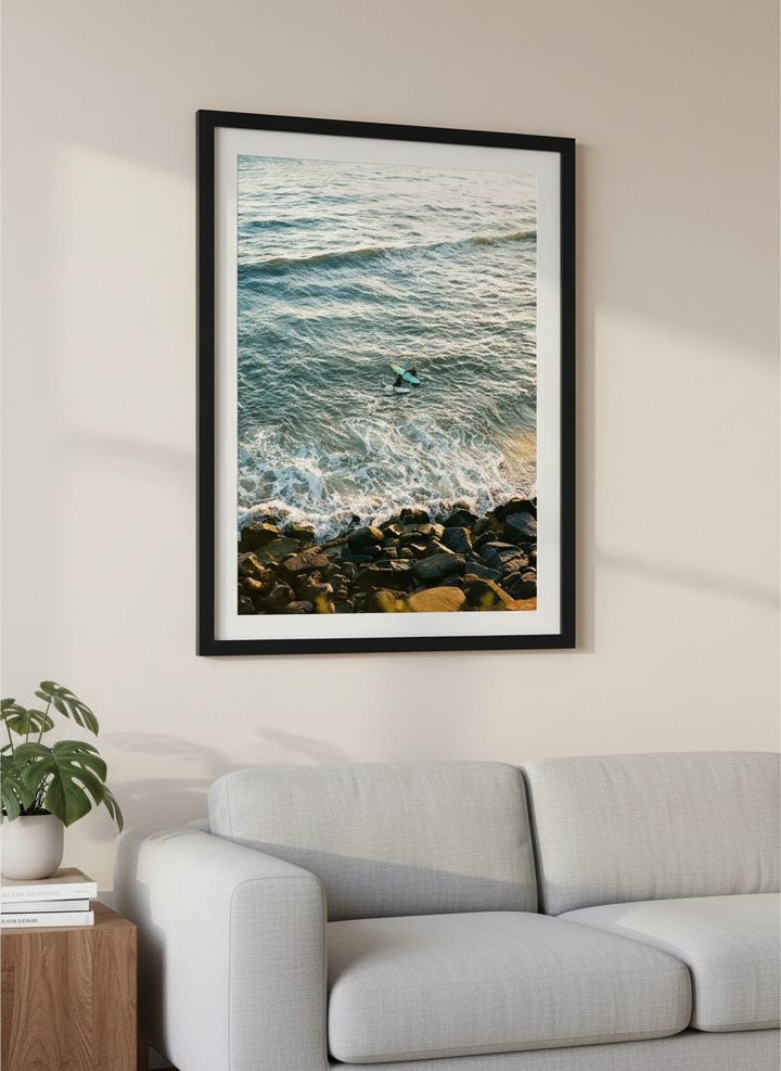 Modern wall art styled above a sofa in a neutral living room
