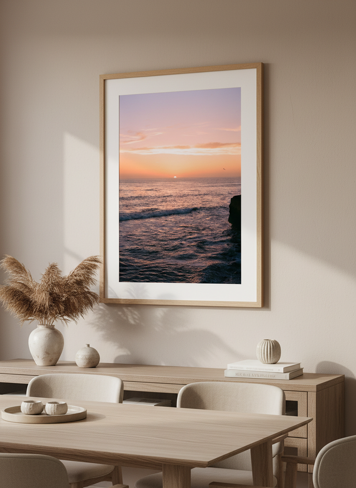 Wall art styled above a dining table in a contemporary home