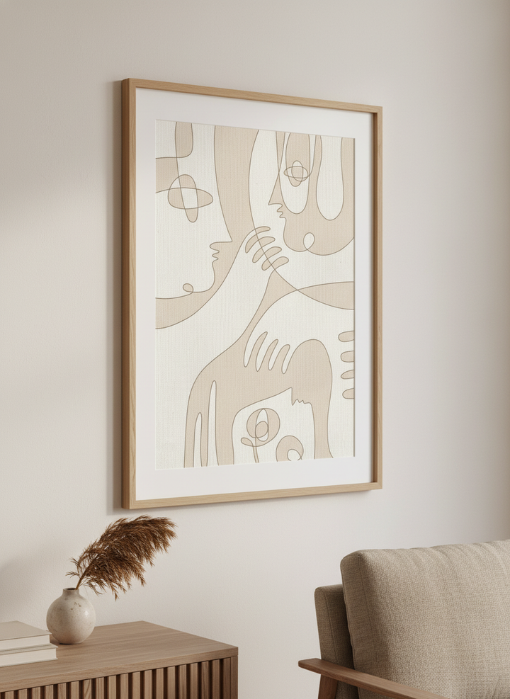 Modern wall art styled above a sofa in a neutral living room