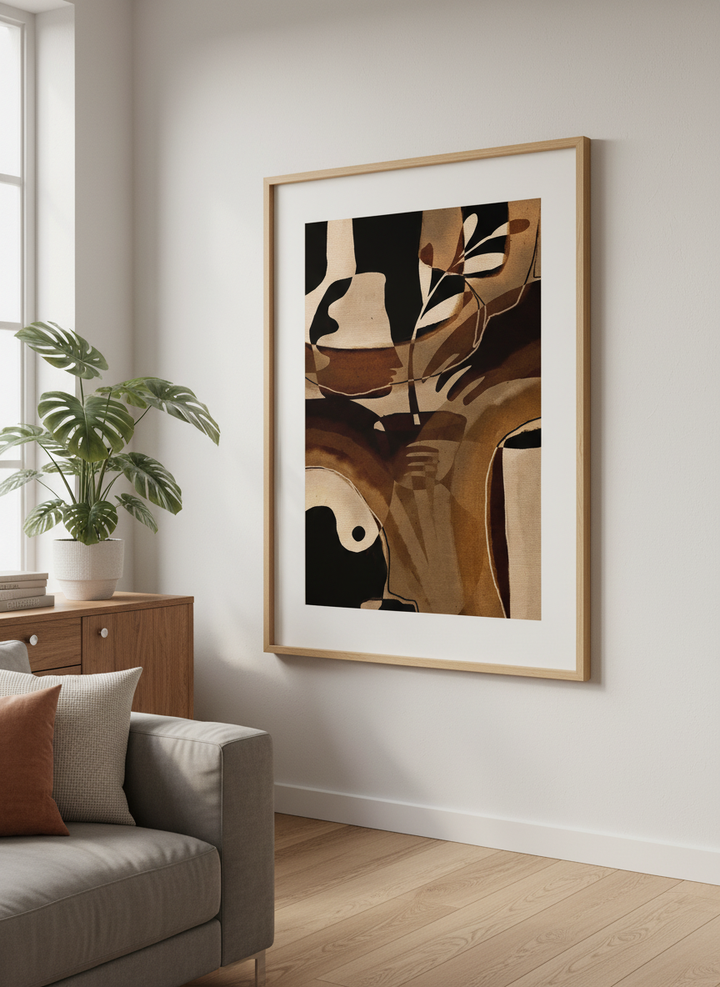 Modern wall art styled above a sofa in a neutral living room