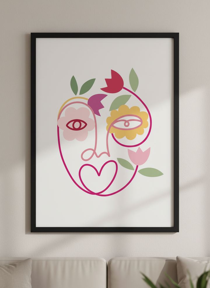 Modern wall art styled above a sofa in a neutral living room