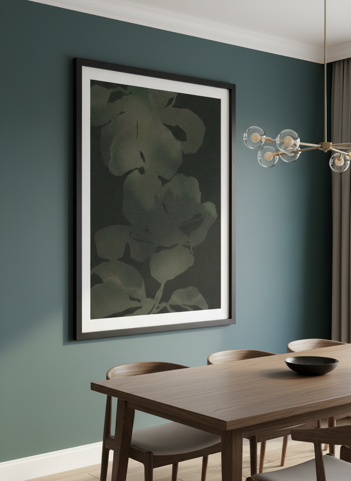 Wall art styled above a dining table in a contemporary home