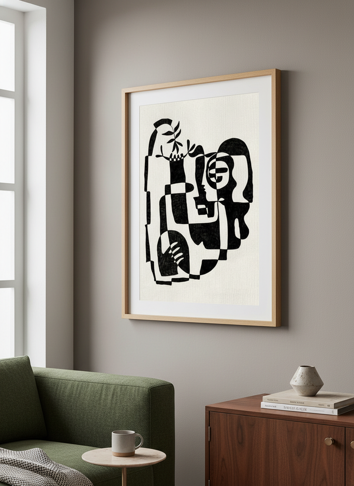 Modern wall art styled above a sofa in a neutral living room