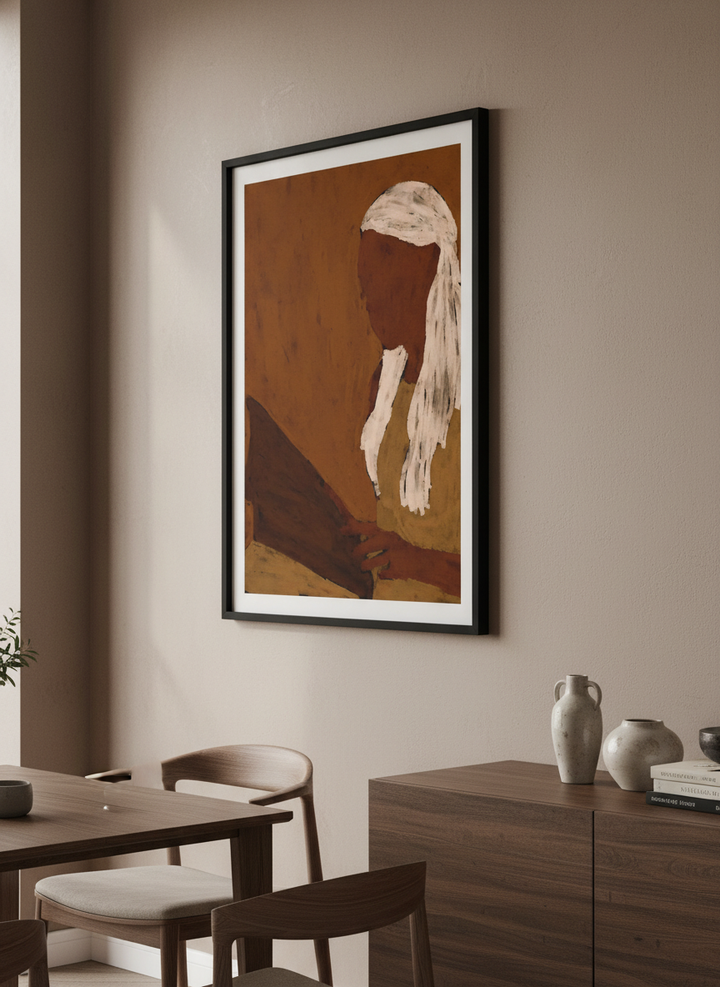 Wall art styled above a dining table in a contemporary home